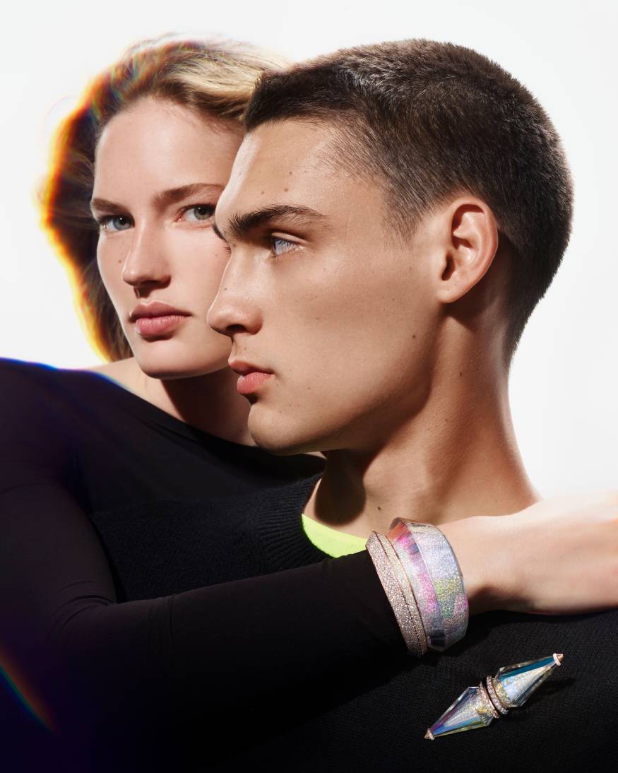 models wearing a bracelet & brooche from the carte blanche holographic collection 