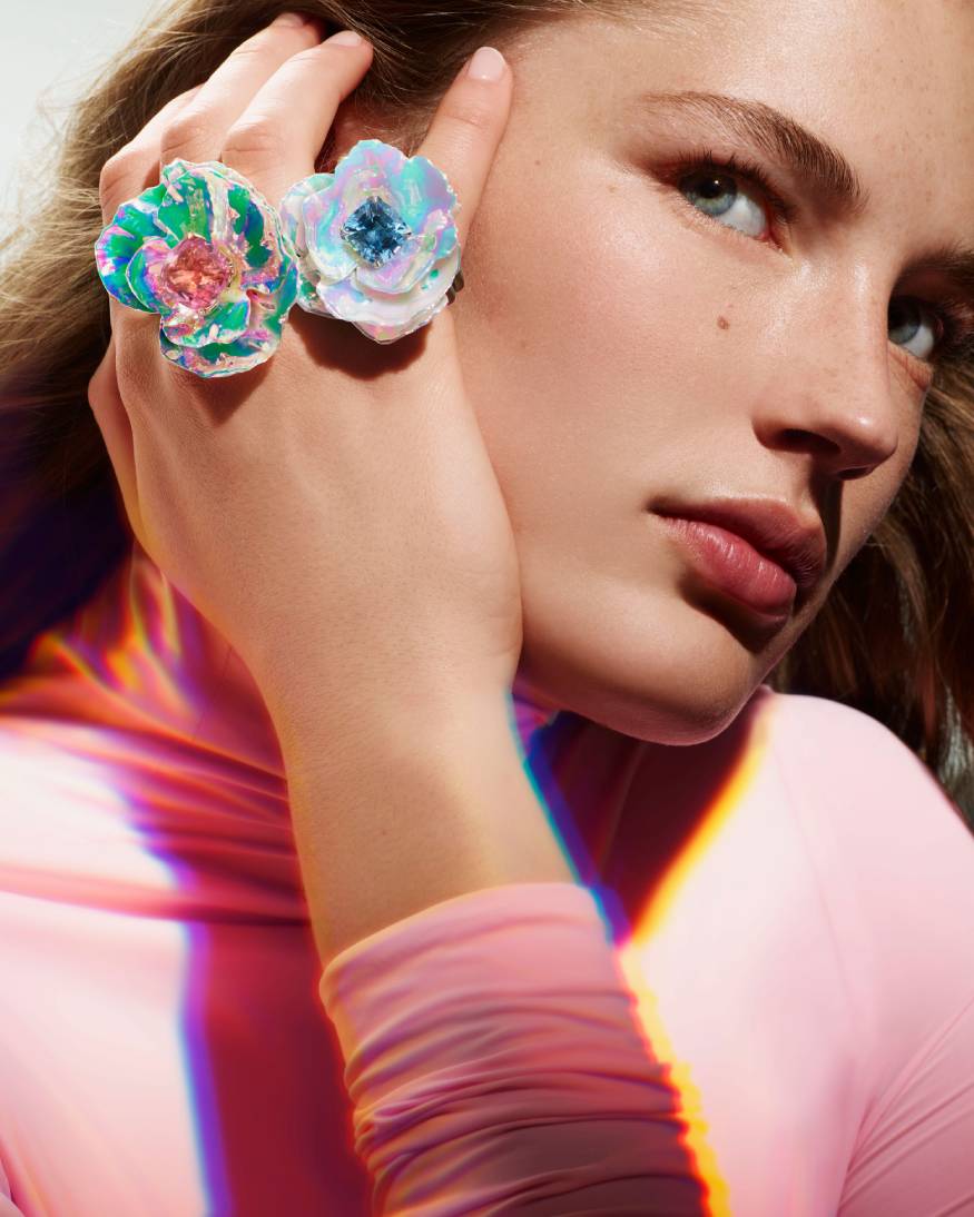 model wearing a flower rings from the carte blanche holographic collection 