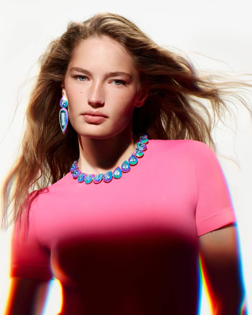 model wearing a earrings & necklace from the carte blanche holographic collection 
